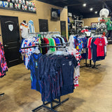 Sports store interior with various sports jerseys on display